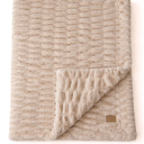 The SnuggleStretch™ Blanket in 'Very Demure'