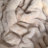 The SnuggleStretch™ Blanket in 'Very Demure'