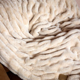 The SnuggleStretch™ Blanket in 'Very Demure'
