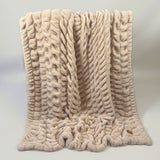 The SnuggleStretch™ Blanket in 'Very Demure'